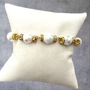 Gold plated bracelet, clear crystals & white beads plus a round toggle
